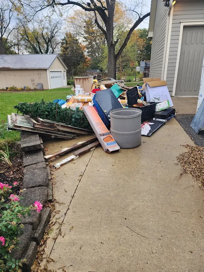 Dumpster being loaded with debris for Residential Dumpster Rental in Calumet Park